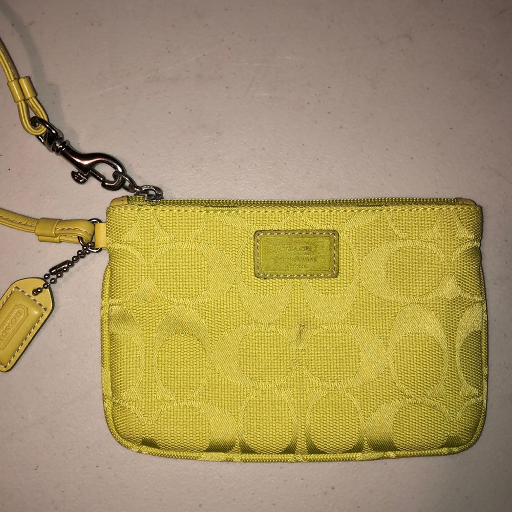 Neon yellow coach wristlet
